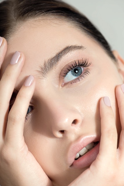 Close-up of a woman with eyelash extension aftercare after getting her lashes done at Radiance Skin House