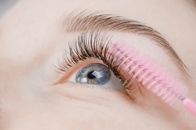 Close-up of natural volume eyelash extensions enhancing green eyes at Radiance skin Beauty